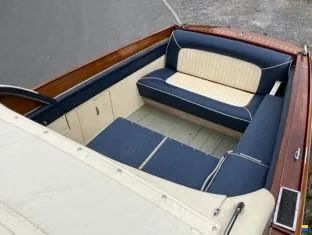 Rear bench upholstered in navy and cream