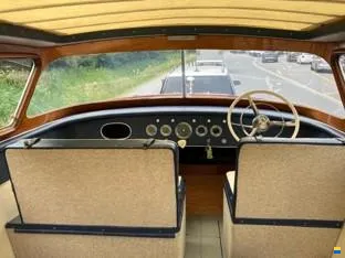 Original dashboard with chrome gauges and wooden wheel